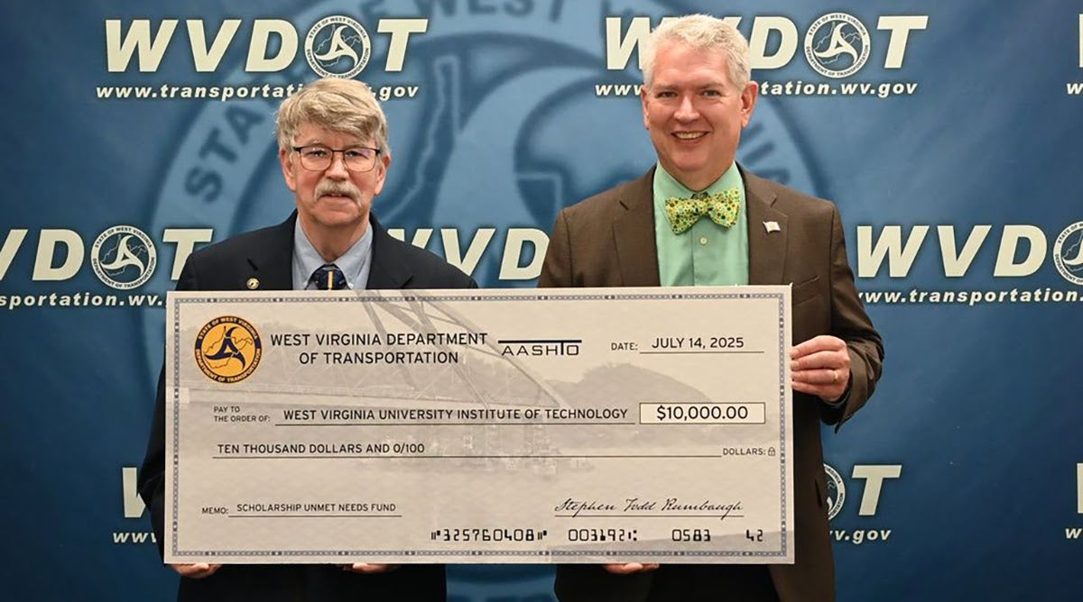 Two men holding a $10,000 ceremonial check from WVDOT to WVU Tech